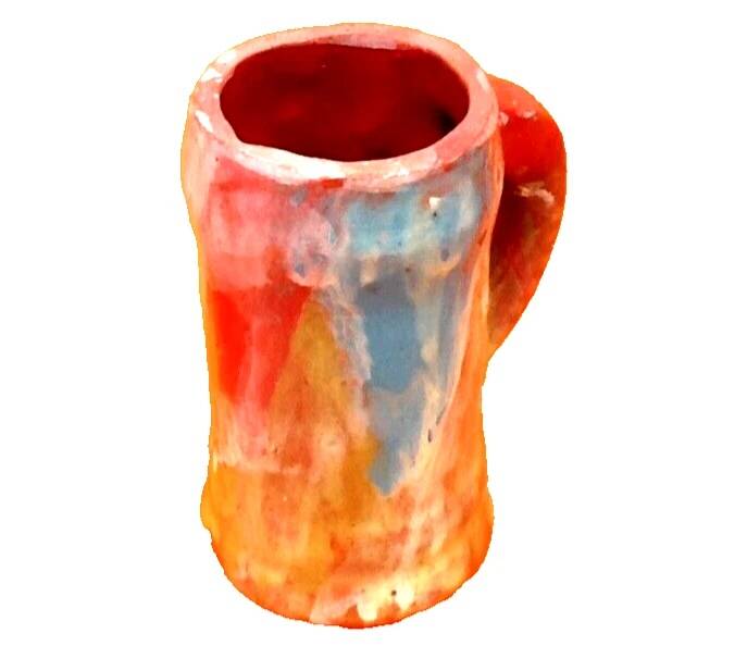 Traditional ceramic mug with a marbled glaze effect.