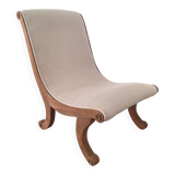 Vintage gondola armchair in beige linen fabric.