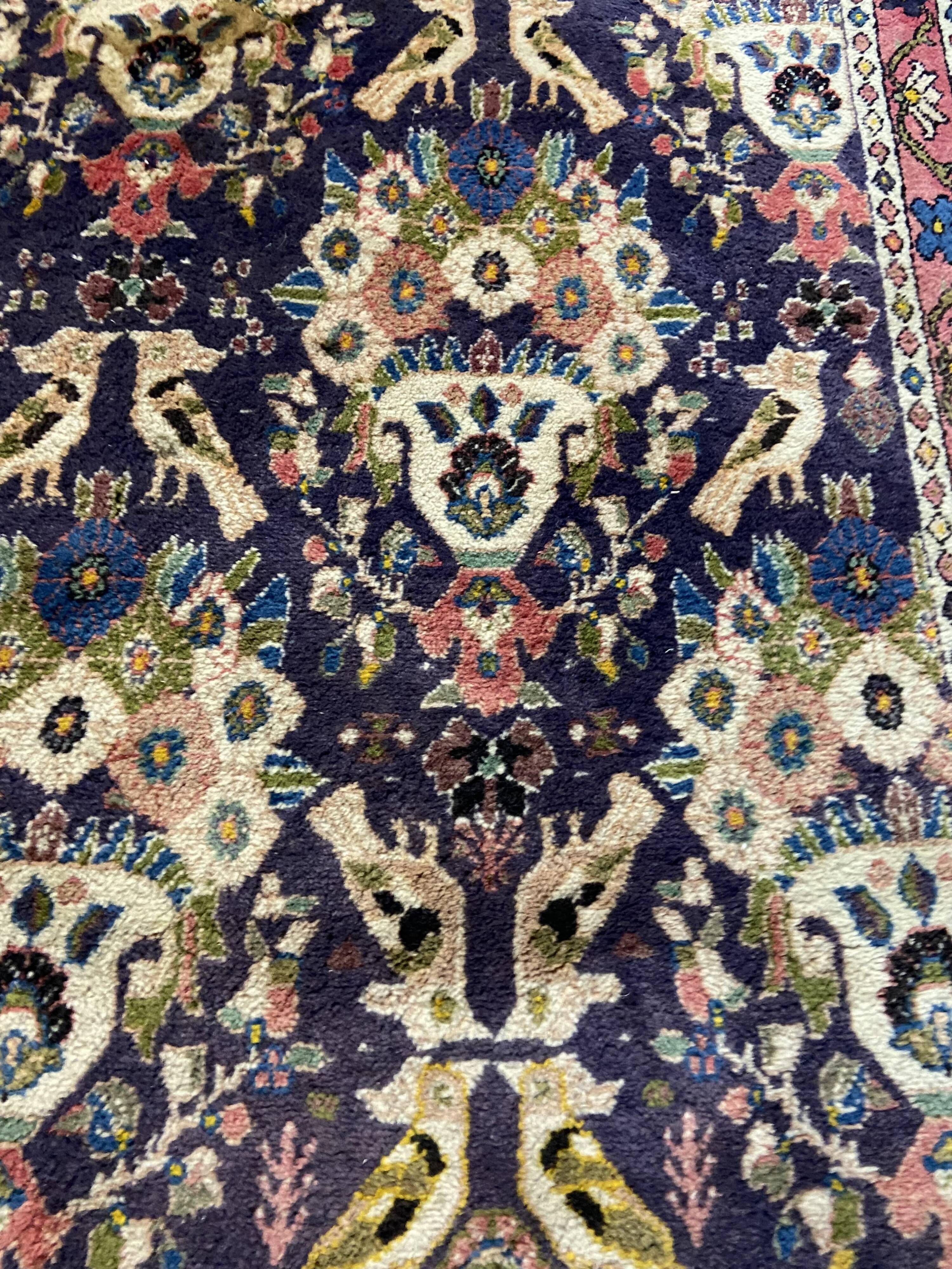 Antique Oriental rug from a nomadic tribe, 1950-1980, birds on a purple background