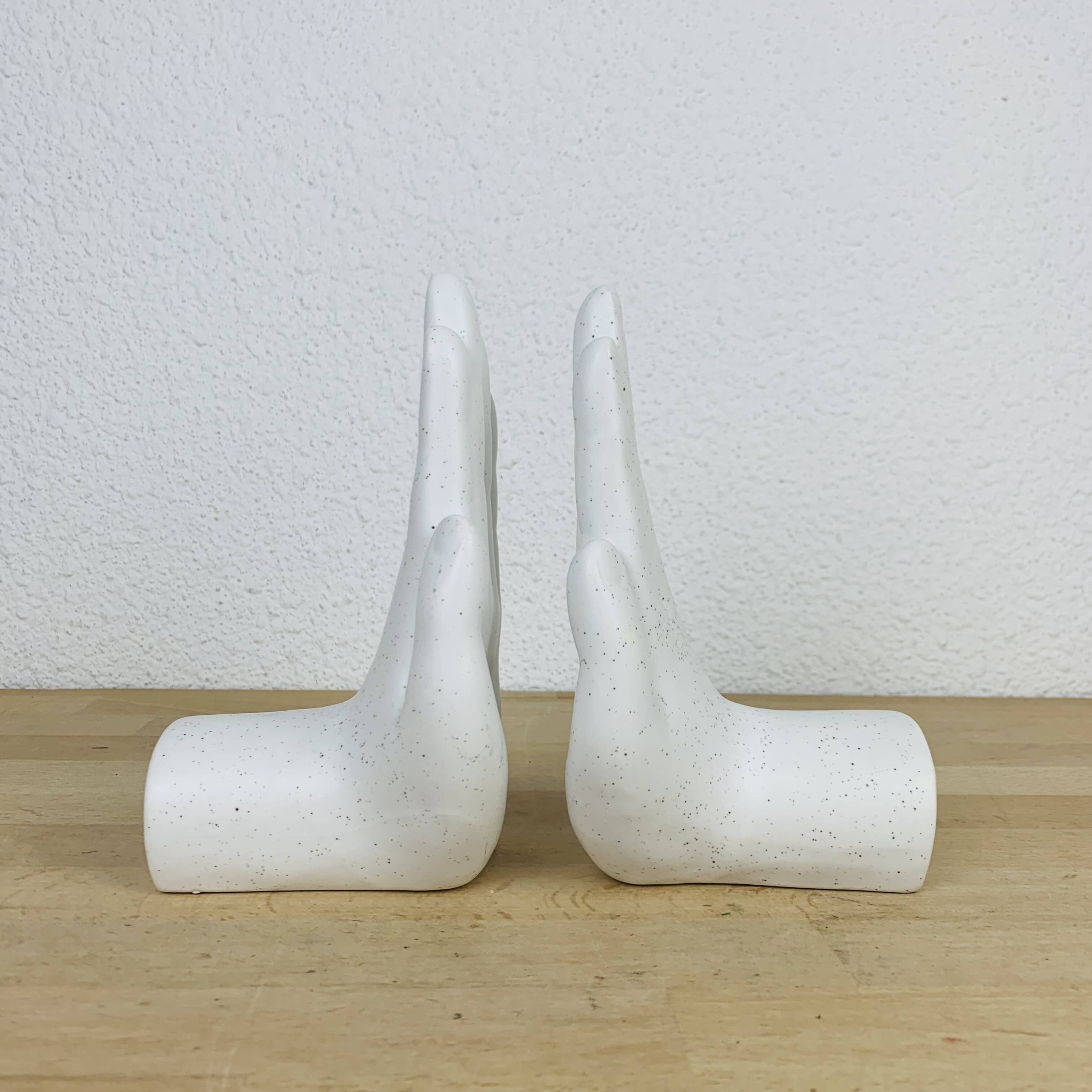 Pair of white ceramic hand bookends
