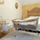 Rattan and wrought iron cradle
