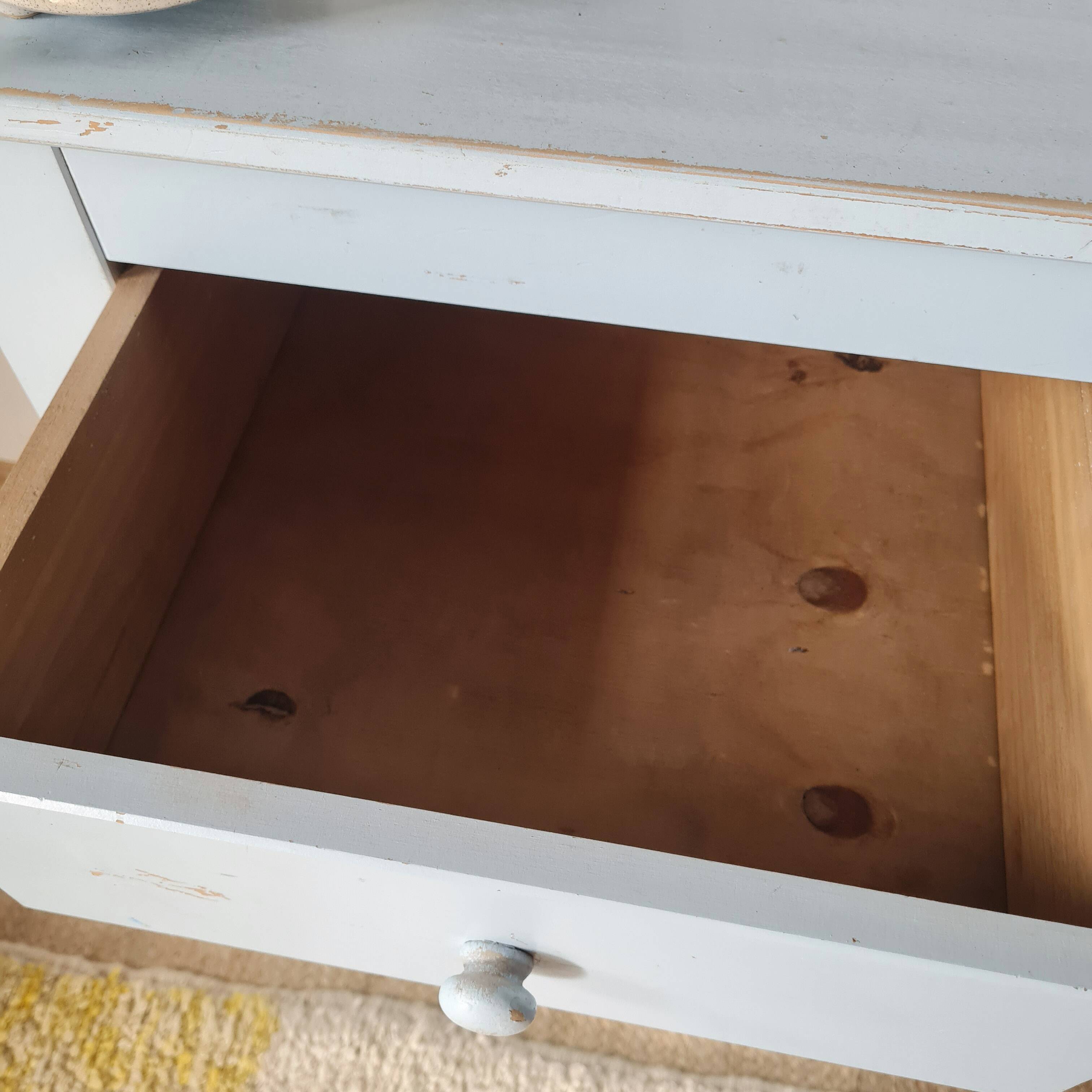 Handcrafted blue chest of drawers.