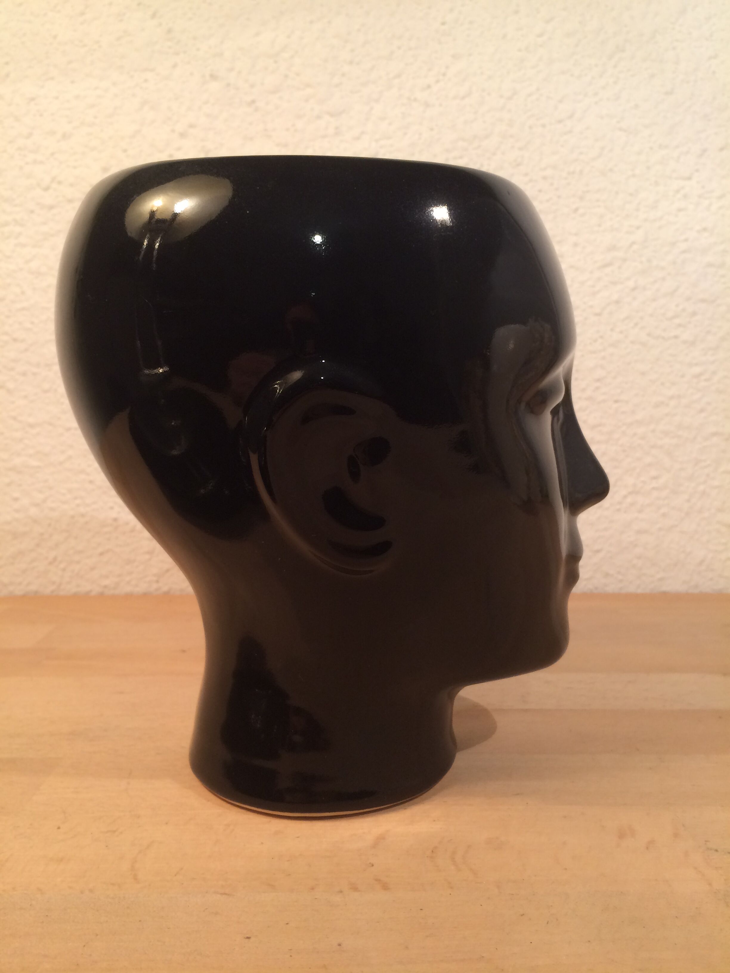 2 black and white ceramic head vases, face