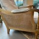 Sofa and armchair in cane and wood by Jean Roche