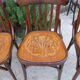 4 bentwood bistro chairs with a pattern on the seat