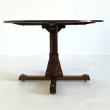 Wooden round dining table from ISA Bergamo with unique base