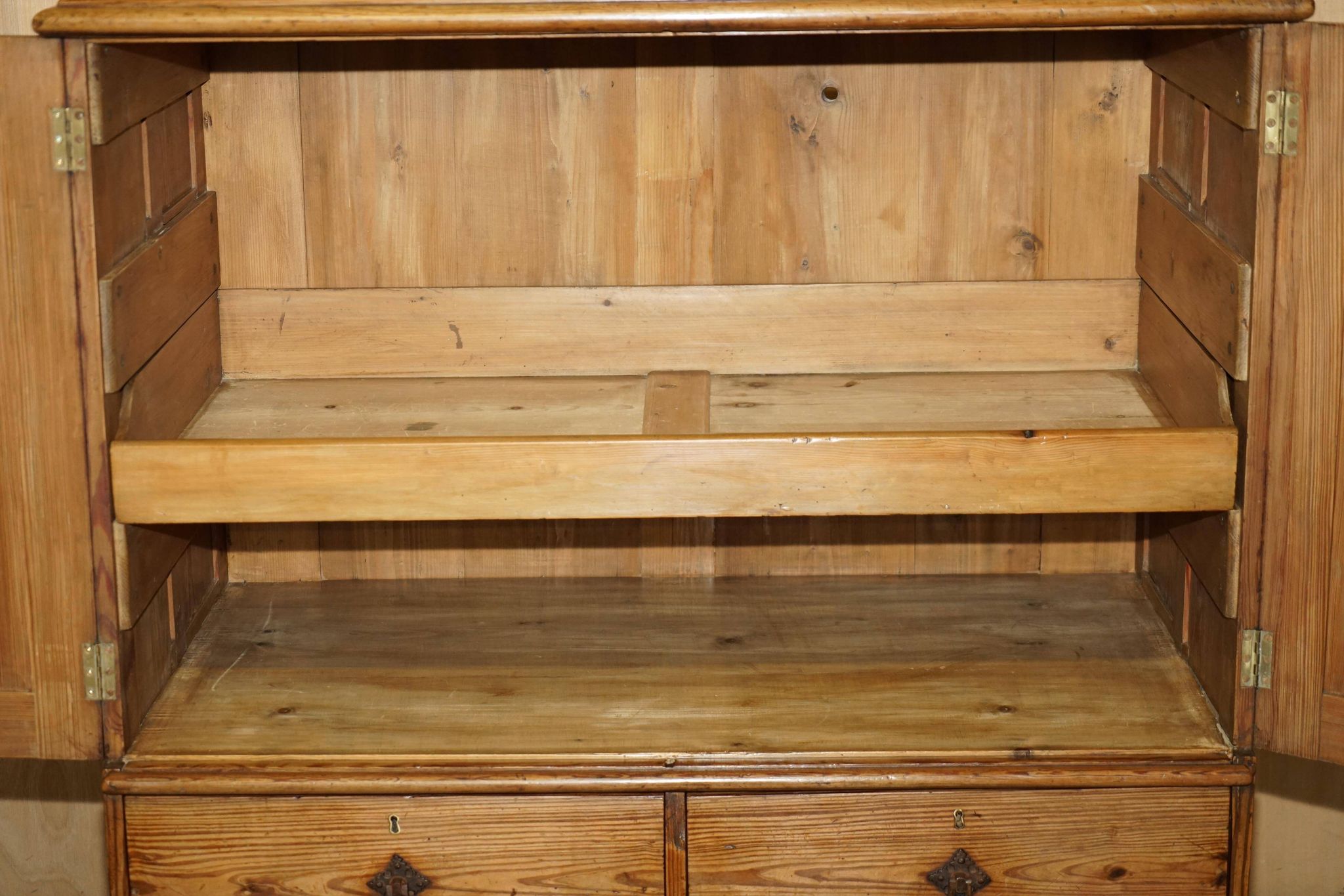 Antique Victorian pine governess buffet with sliding shelf.