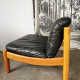 Pair of designer leather armchairs 80s