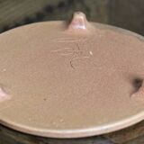 Sandstone trivet, signed