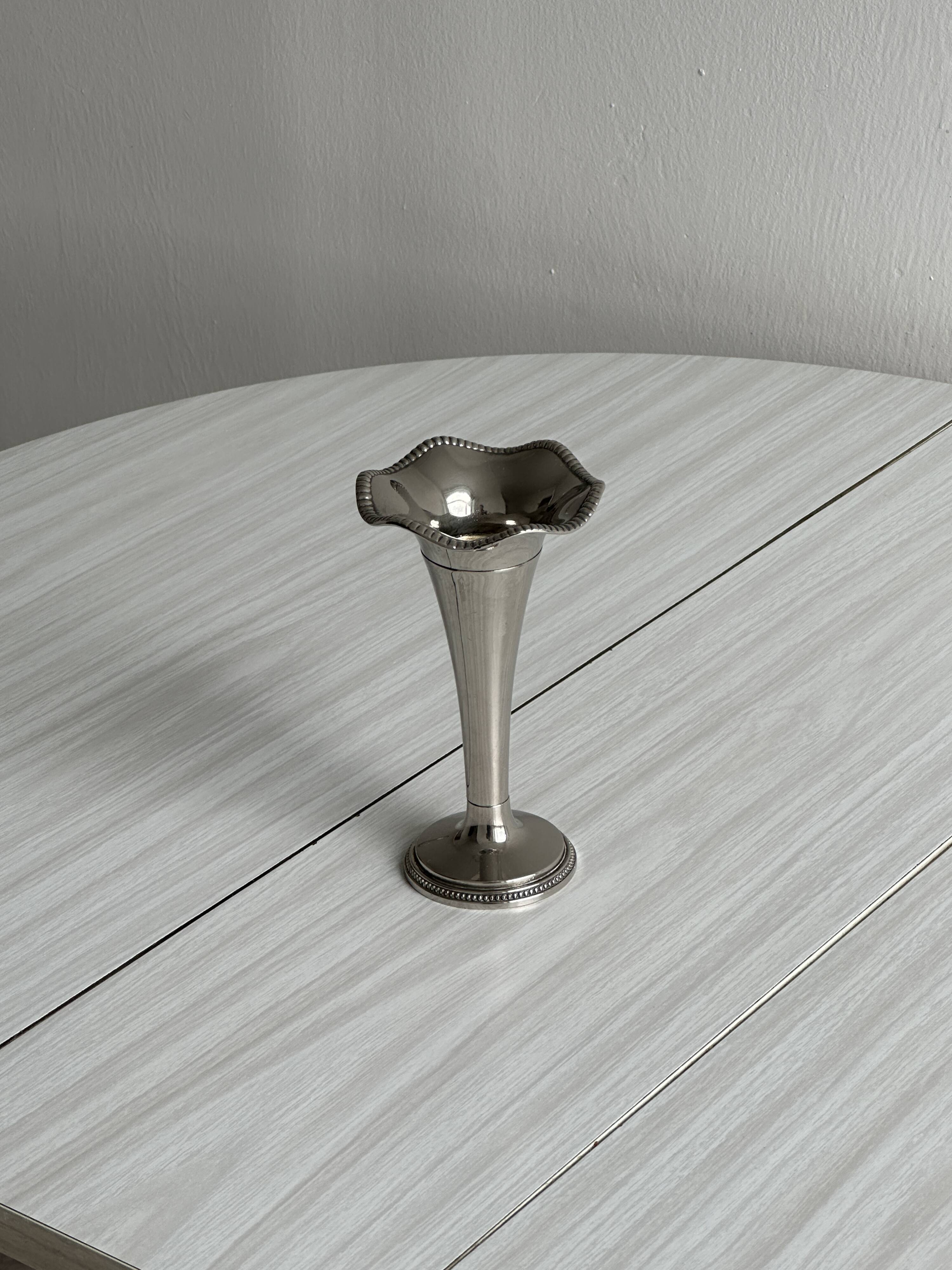 Small silver metal vase