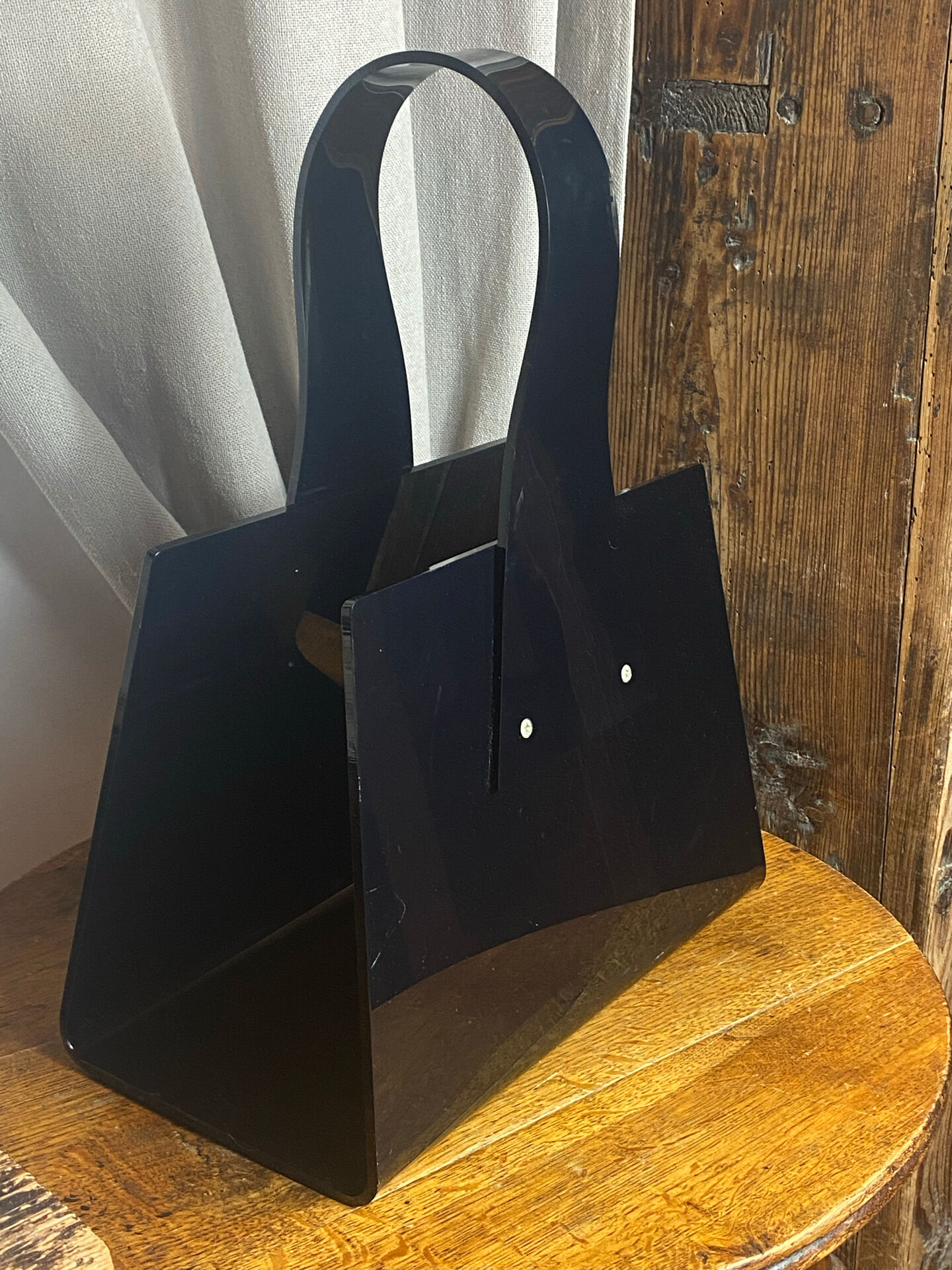Black plexiglass magazine rack