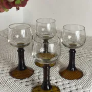 Footed glasses of the Roemer type, amber colour