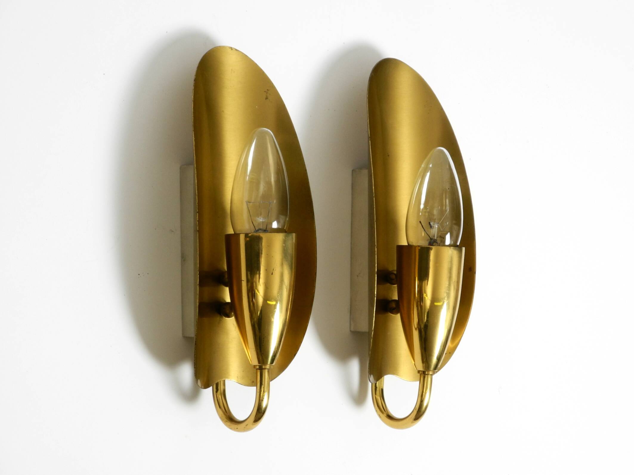 Two magical original Mid Century Modern bag brass wall lamps