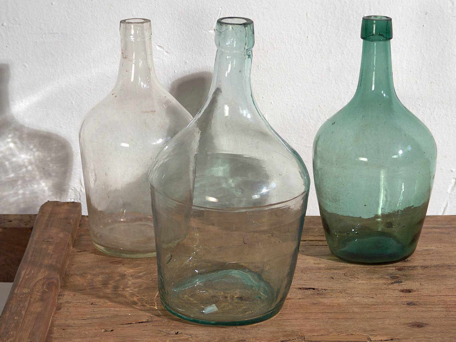Antique colored demijohns (c.1920). Set of 3 pieces
