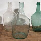 Antique colored demijohns (c.1920). Set of 3 pieces