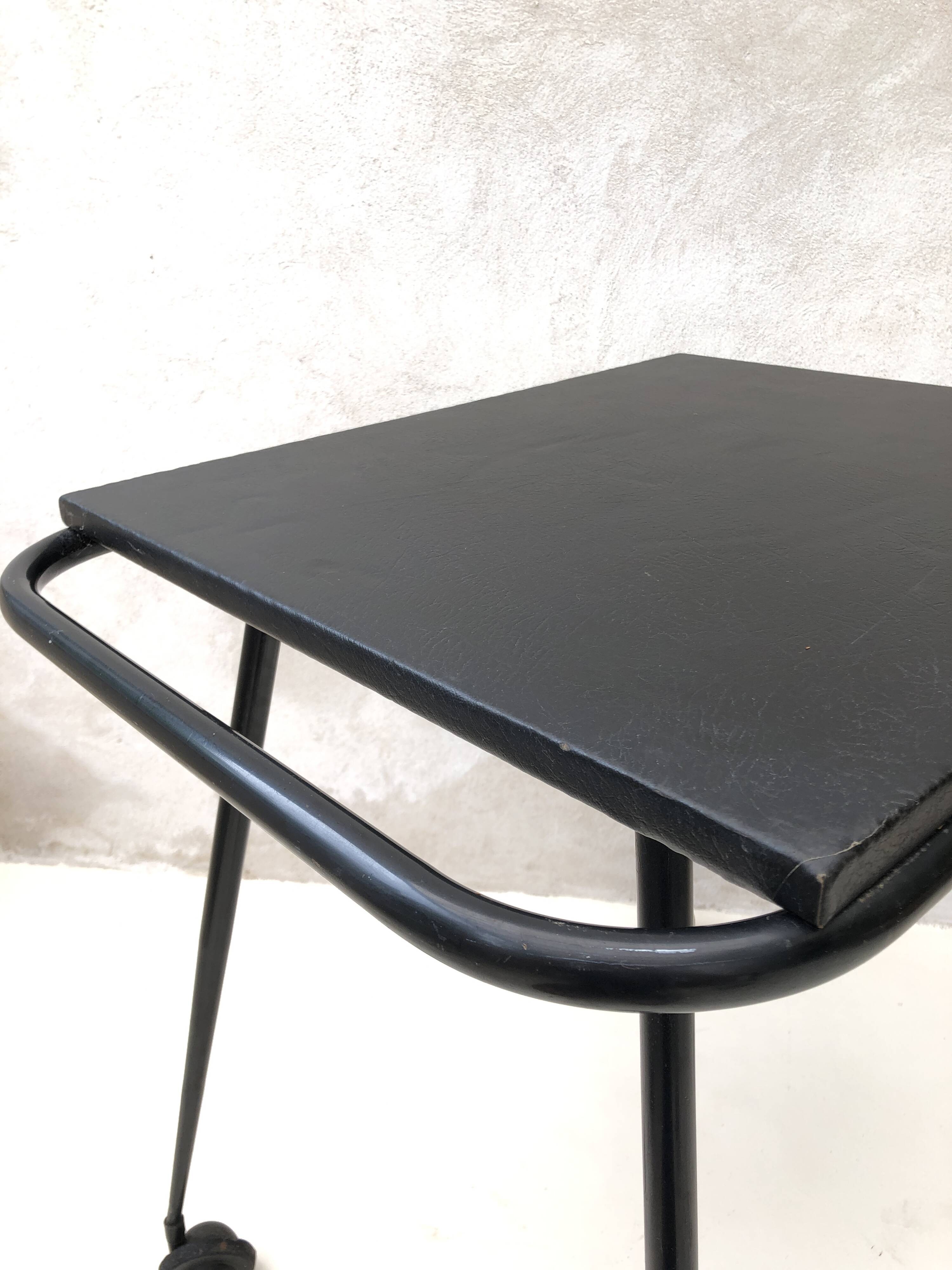 Black table on wheels from the 60s