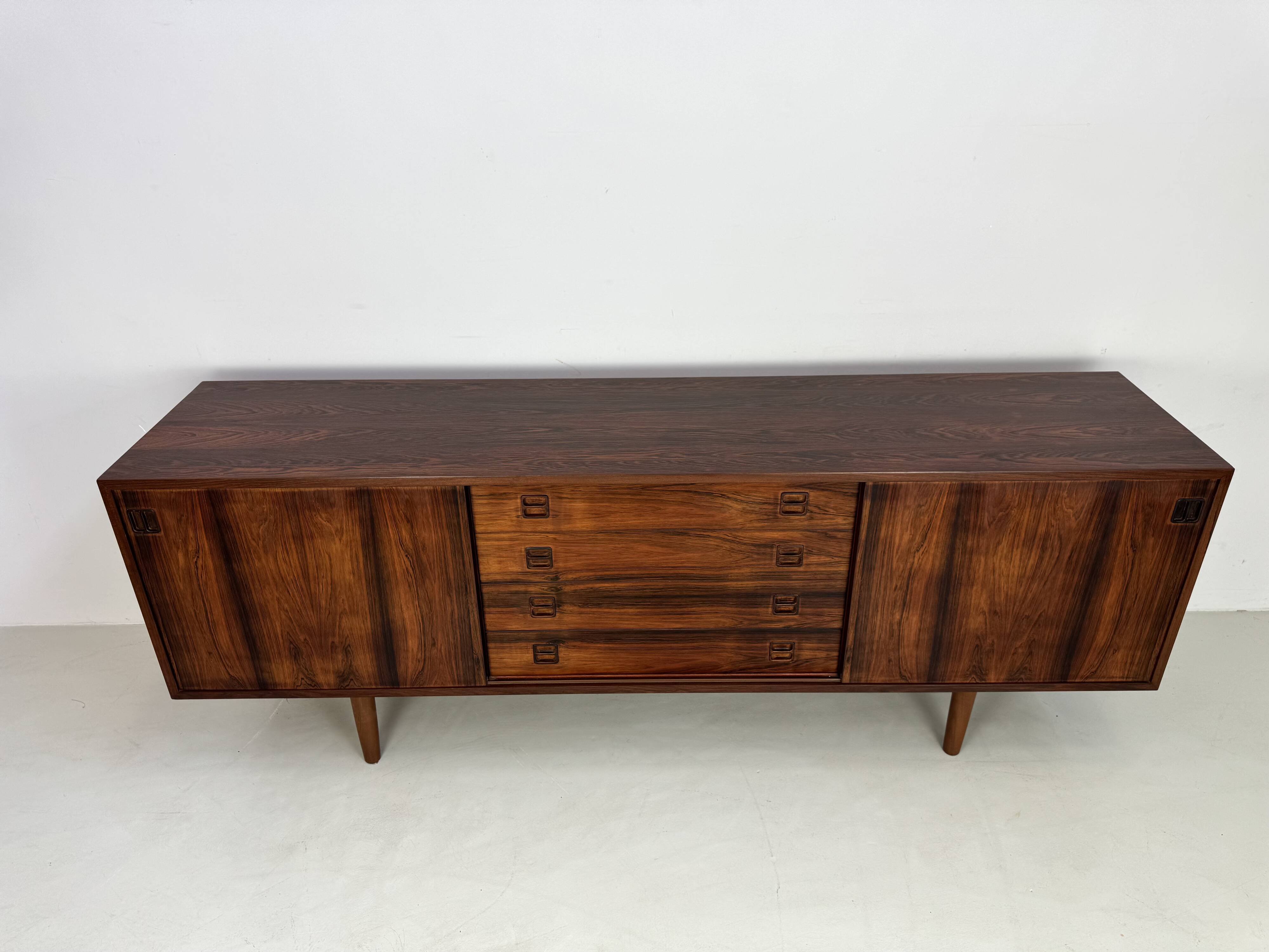 Danish rosewood vintage sideboard with sliding teak doors from the 1960s