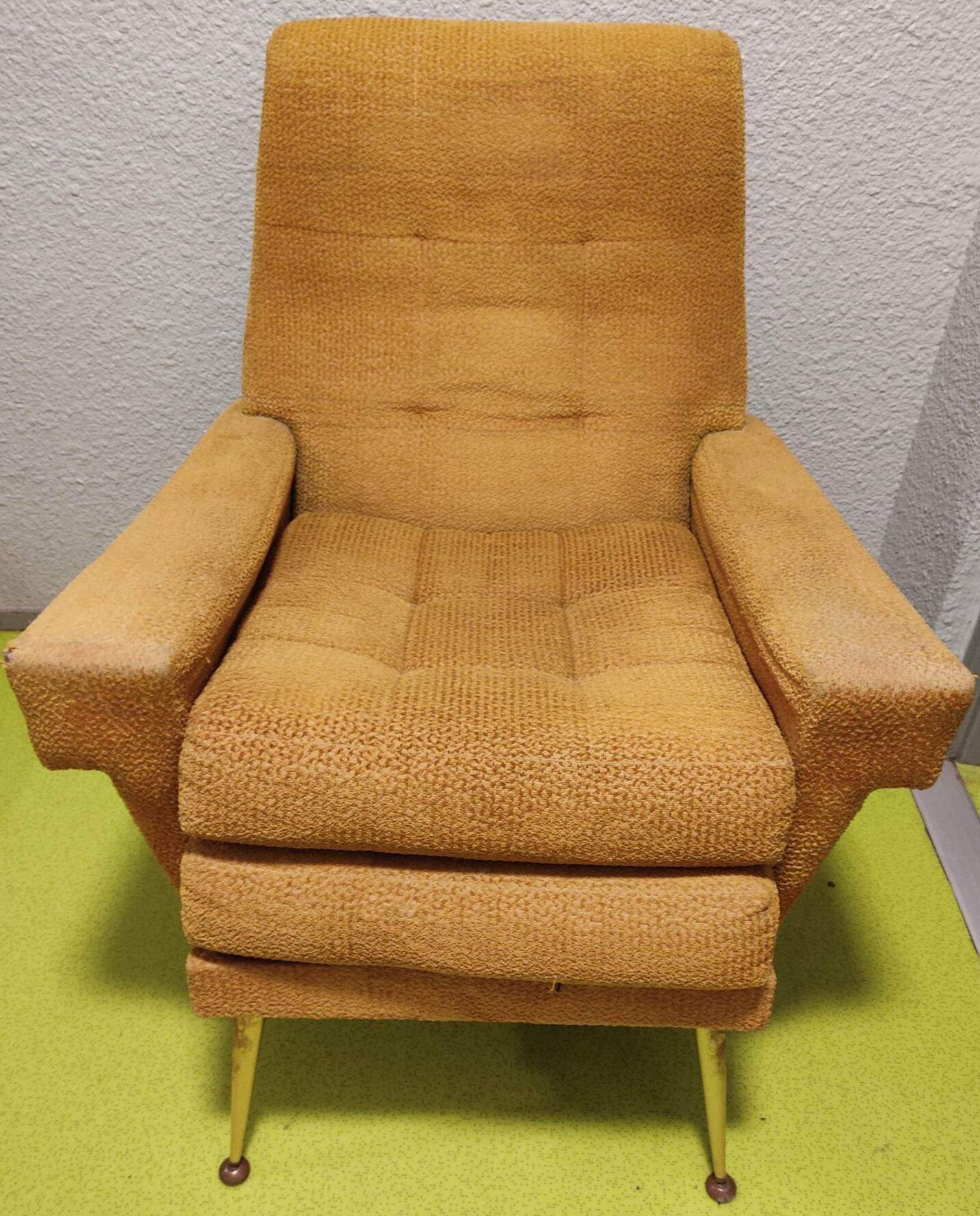 Old velvet heating chair on metal legs