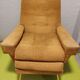 Old velvet heating chair on metal legs