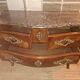 Commode sauteuse galbée de style Louis XV en marqueterie et bronzes dorés (