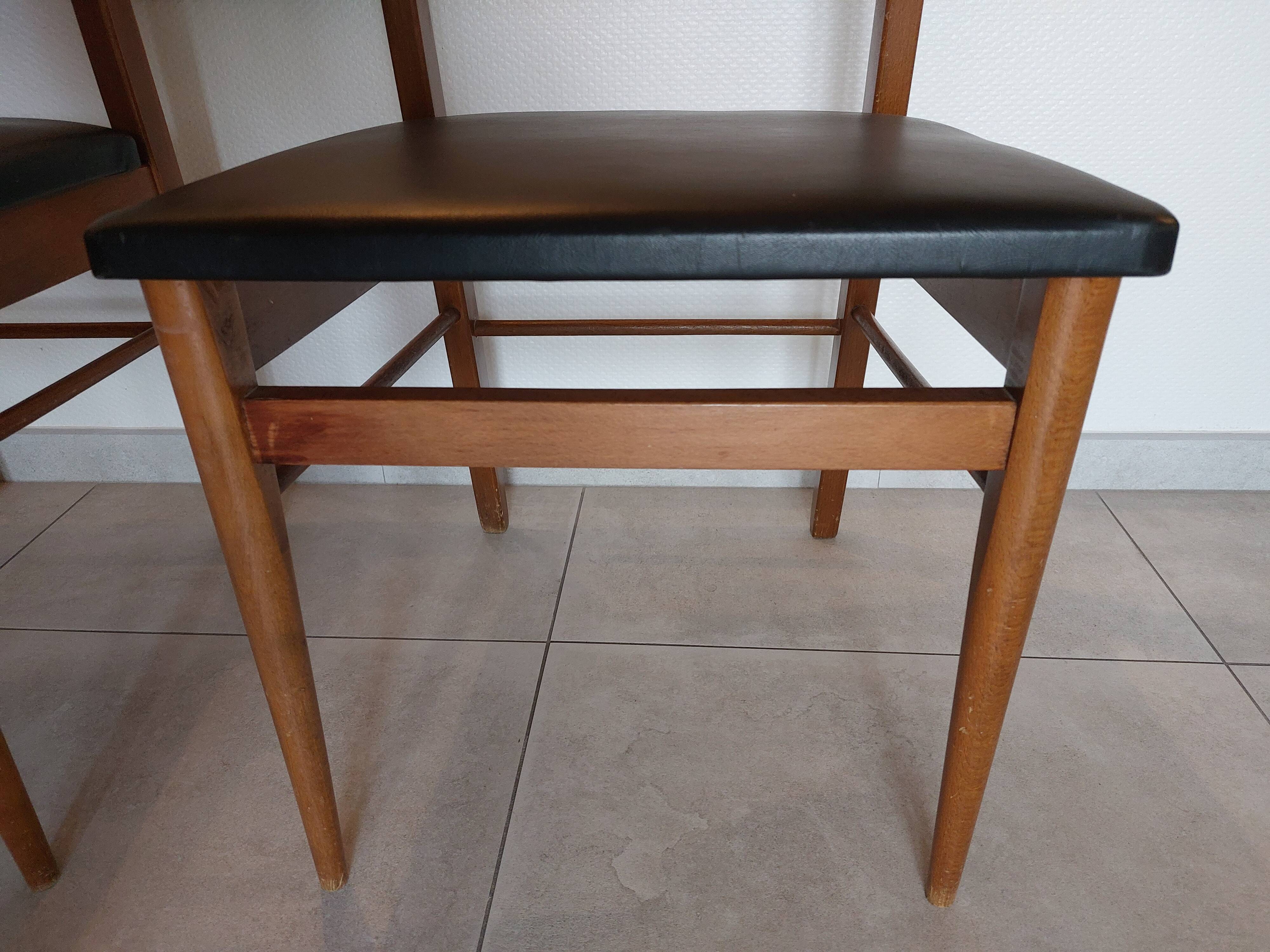 5 Scandinavian style chairs, wood and black faux leather.