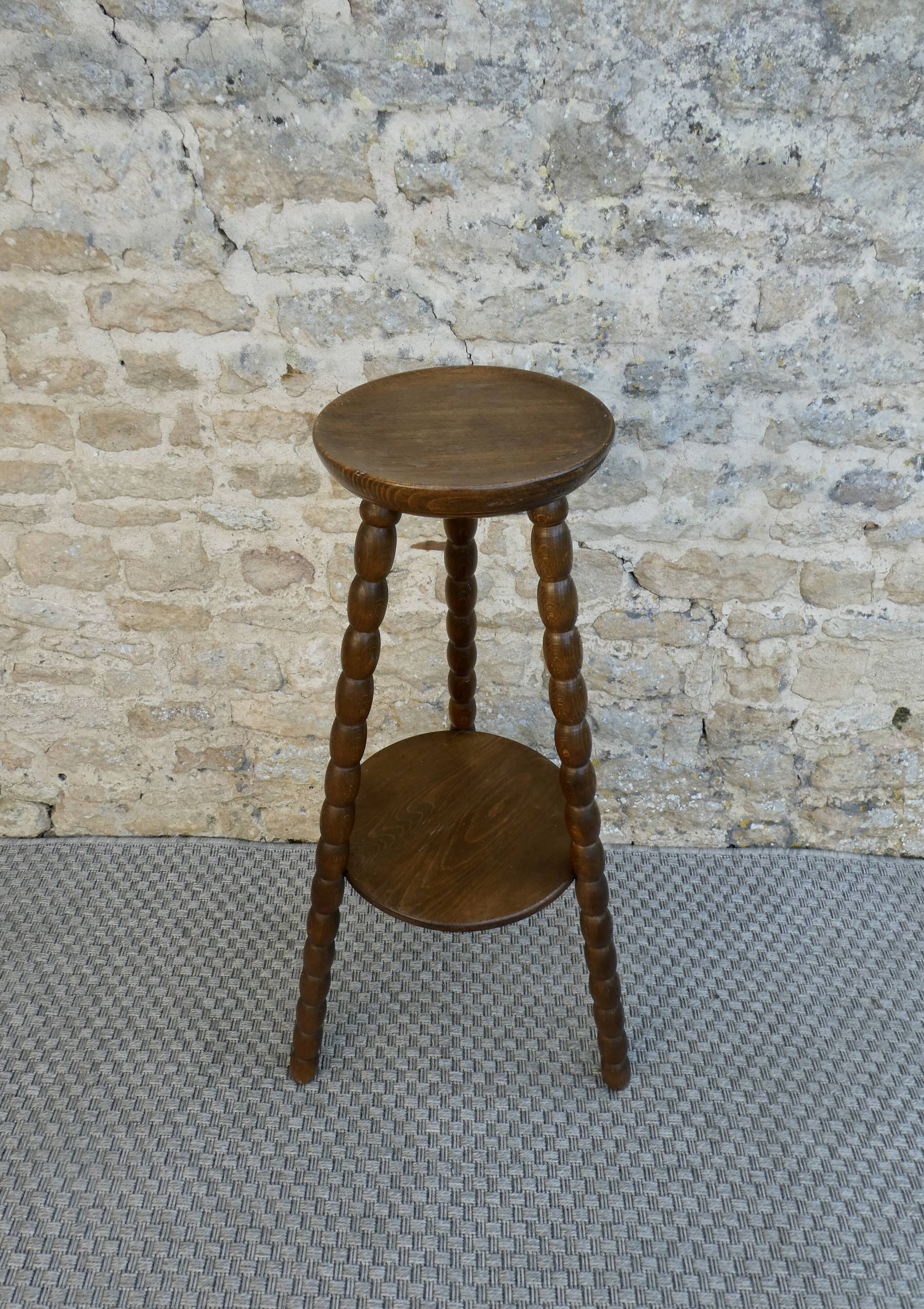 Turned wooden tripod stand