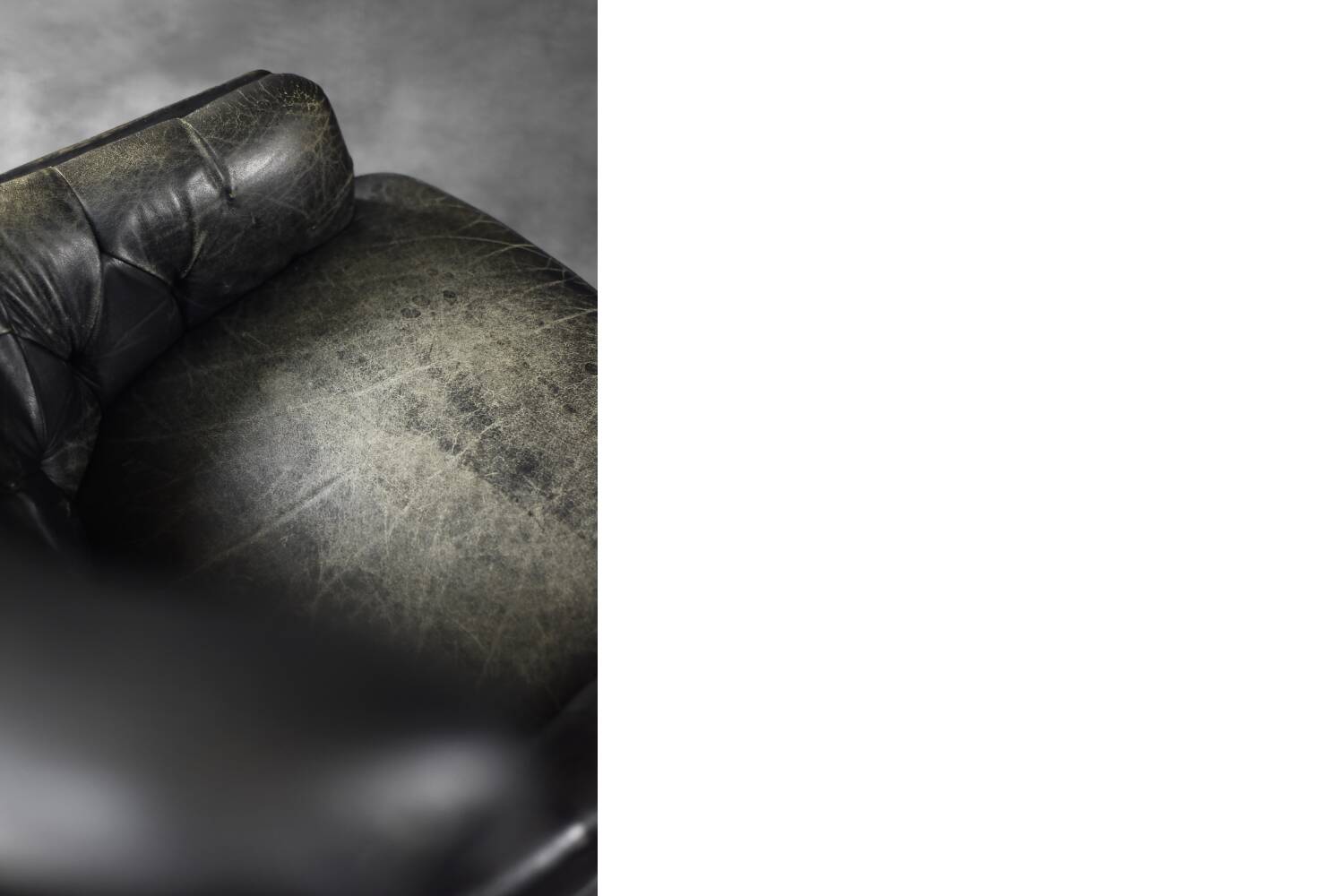 Vintage Danish modern wingback chair in black quilted leather, mid-20th century, 1960s.