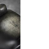 Vintage Danish modern wingback chair in black quilted leather, mid-20th century, 1960s.