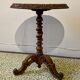 Carved wooden pedestal table