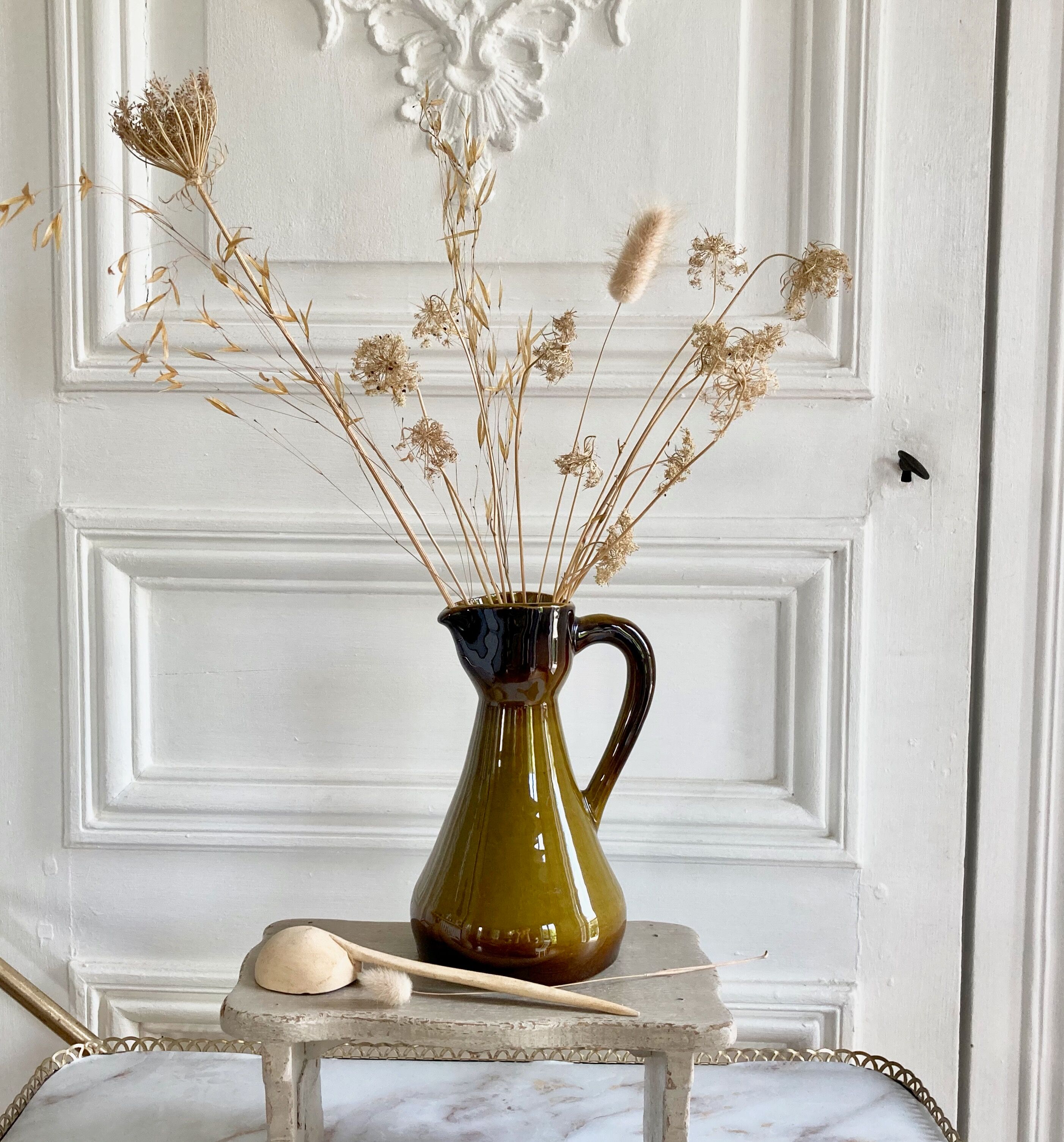 Set of three glazed ceramic pitchers