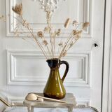 Set of three glazed ceramic pitchers