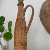 Grande bouteille en verre et osier