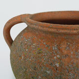 Old round jar with double handles. Year 70
