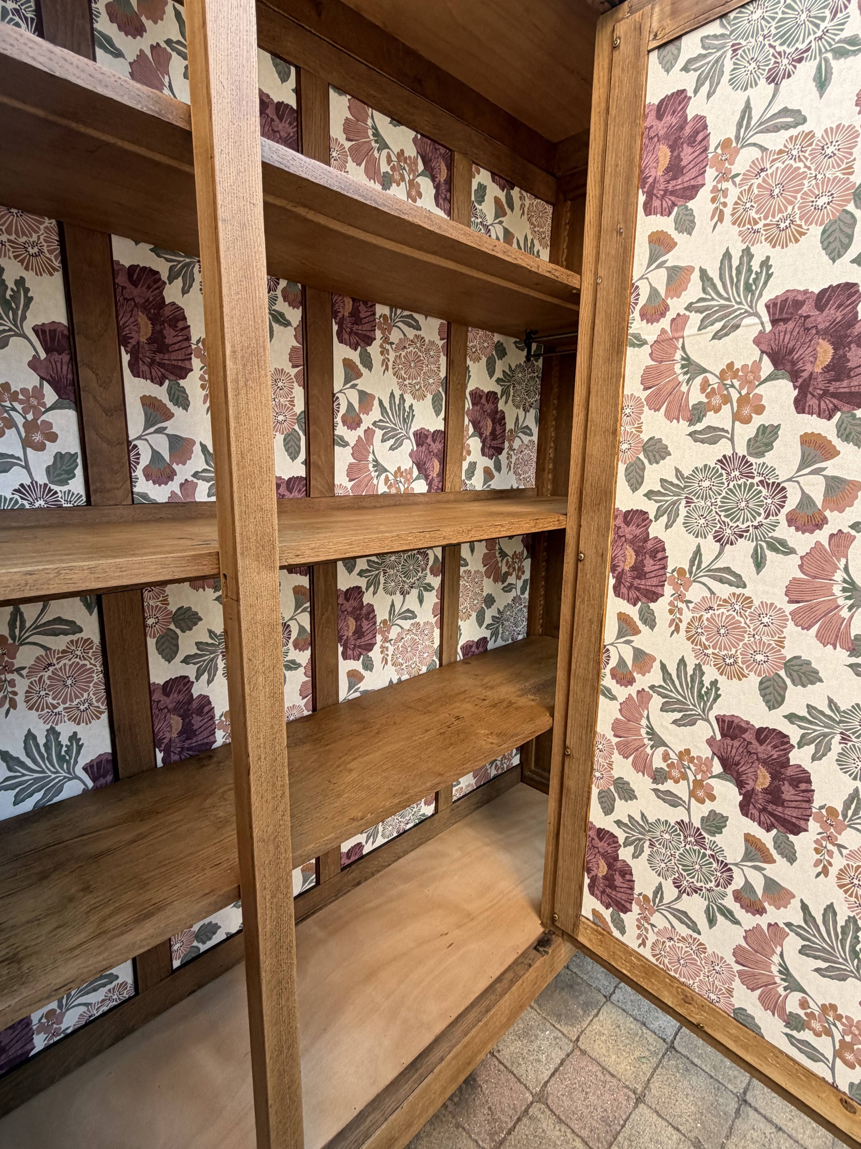 Art deco wardrobe in raw oak with bevelled mirror.