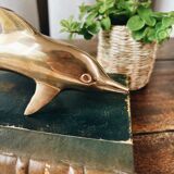Dolphin in golden brass