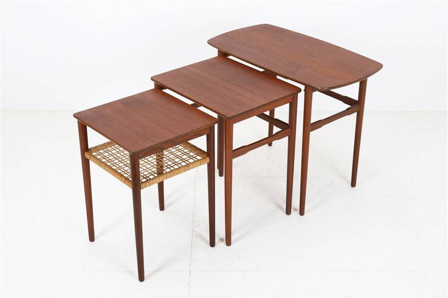 Rare set of three teak nesting tables with cane magazine rack / side tables / mid-century Danish modern design / 1950s / 1960s