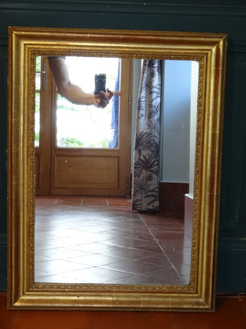 Empire period mirror, early nineteenth in gilded stucco wood H 72 cm