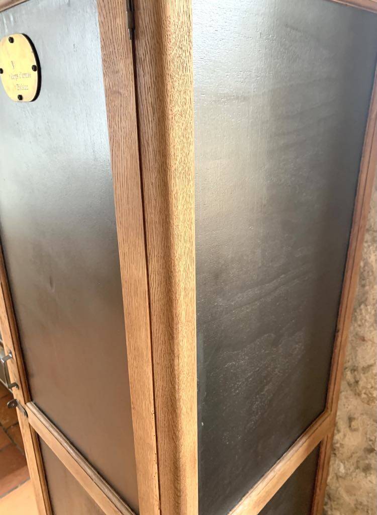 Vintage wooden wardrobe with matte cast iron color hanging rail