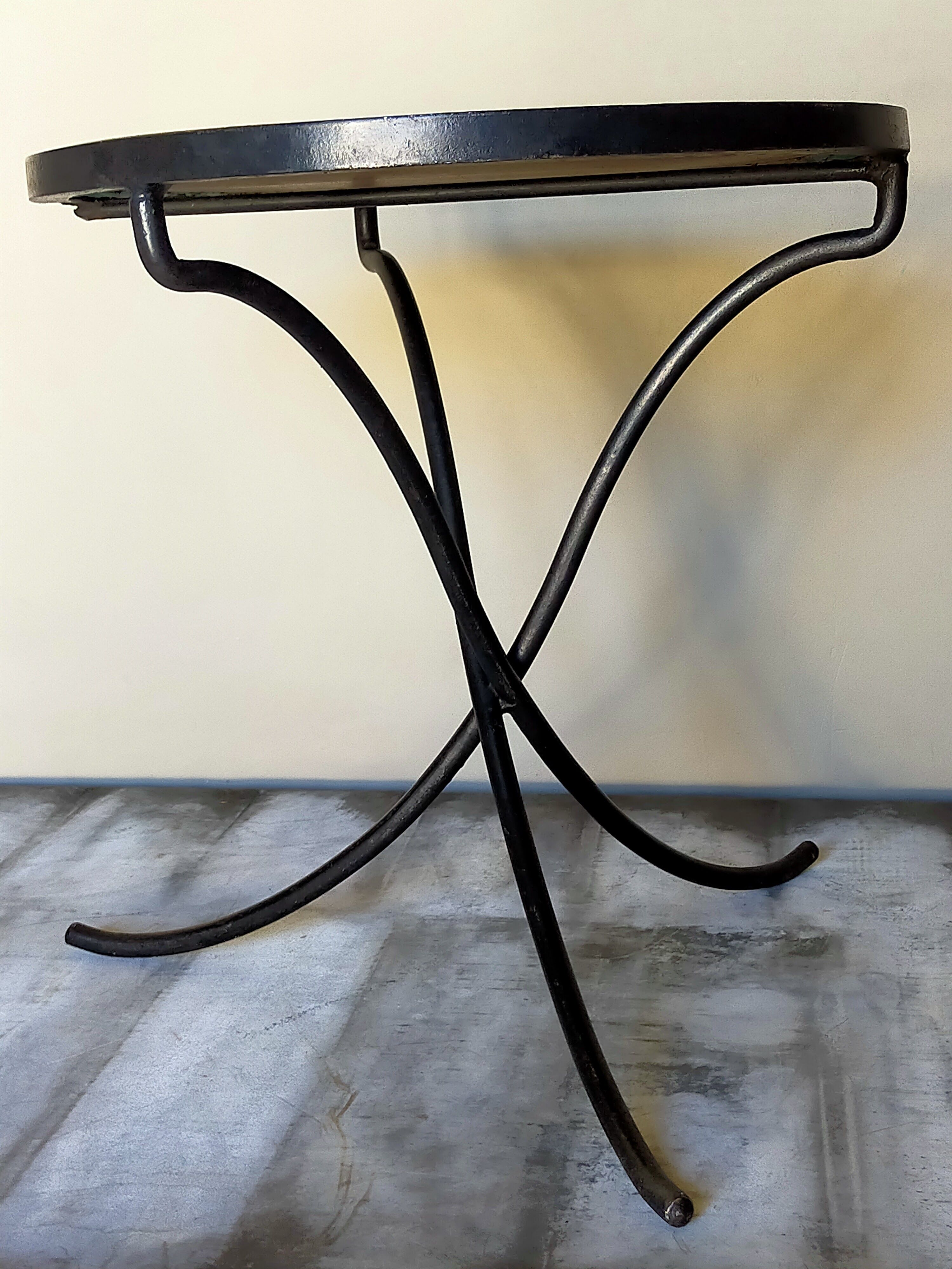 Wrought iron tripod healing in the 1950s