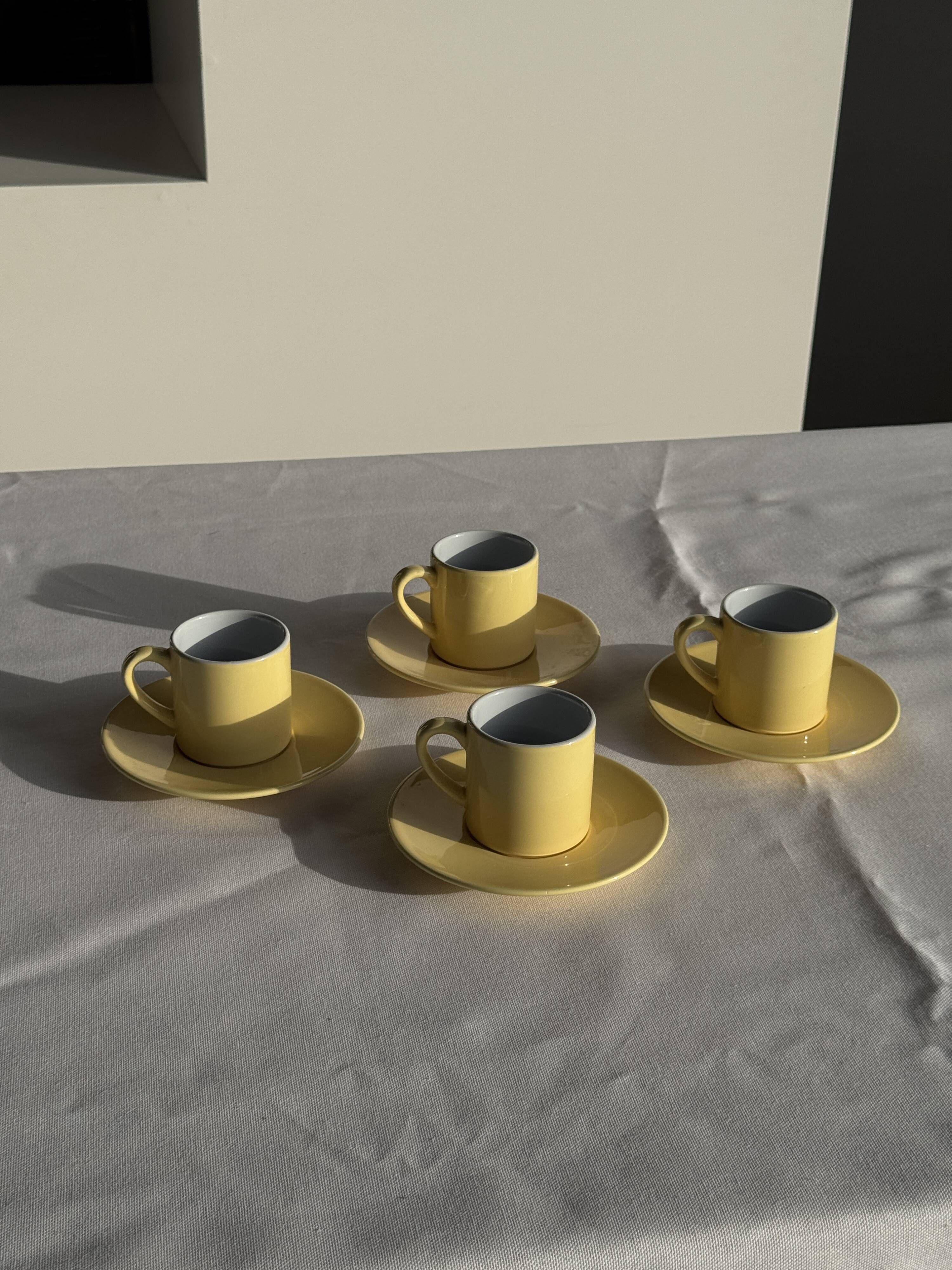 Set of 4 vintage yellow Italian espresso cups and saucers.