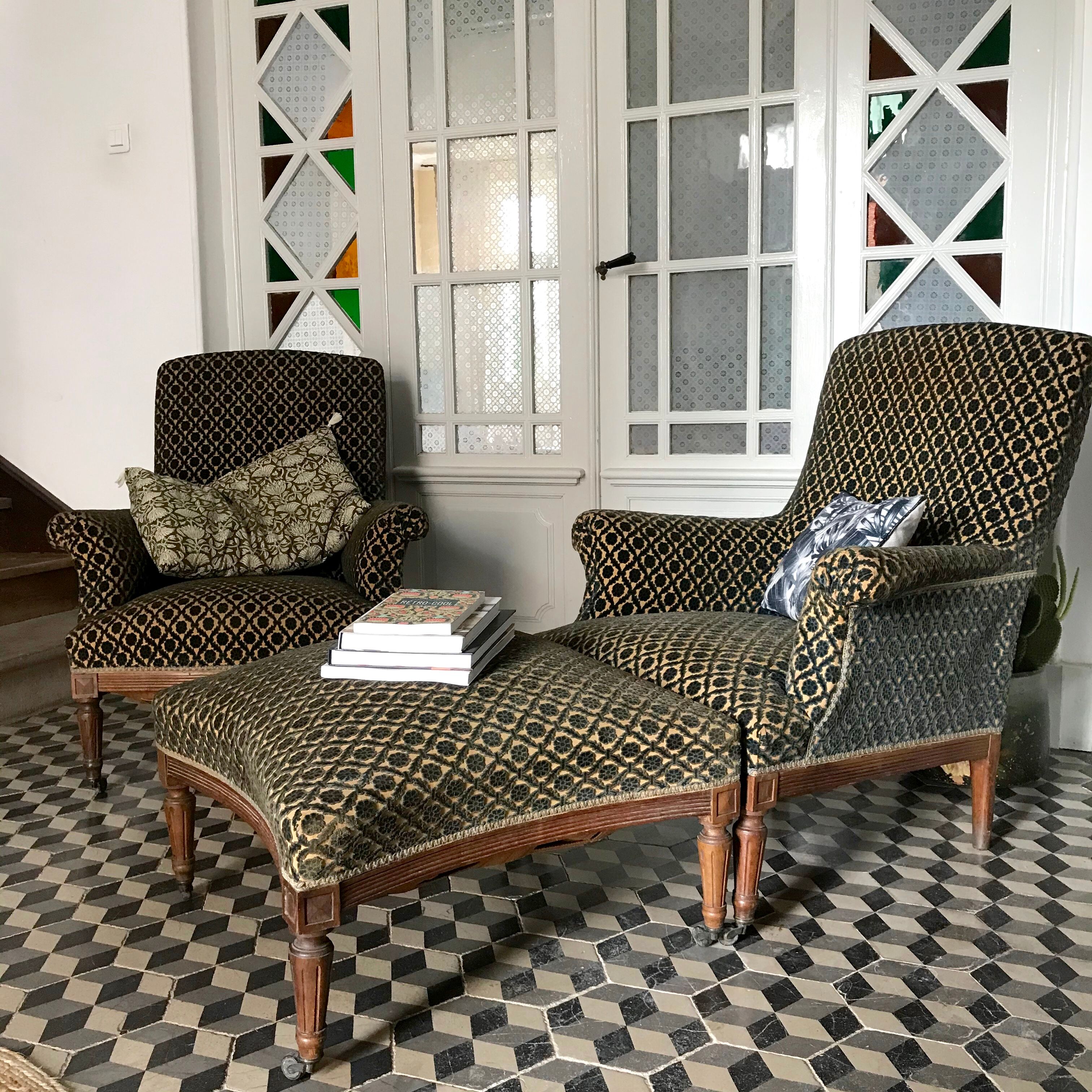 Vintage armchairs and rests feet