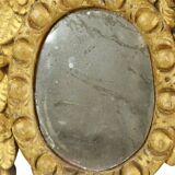 Petit miroir ancien patiné en bois doré du XIXe siècle