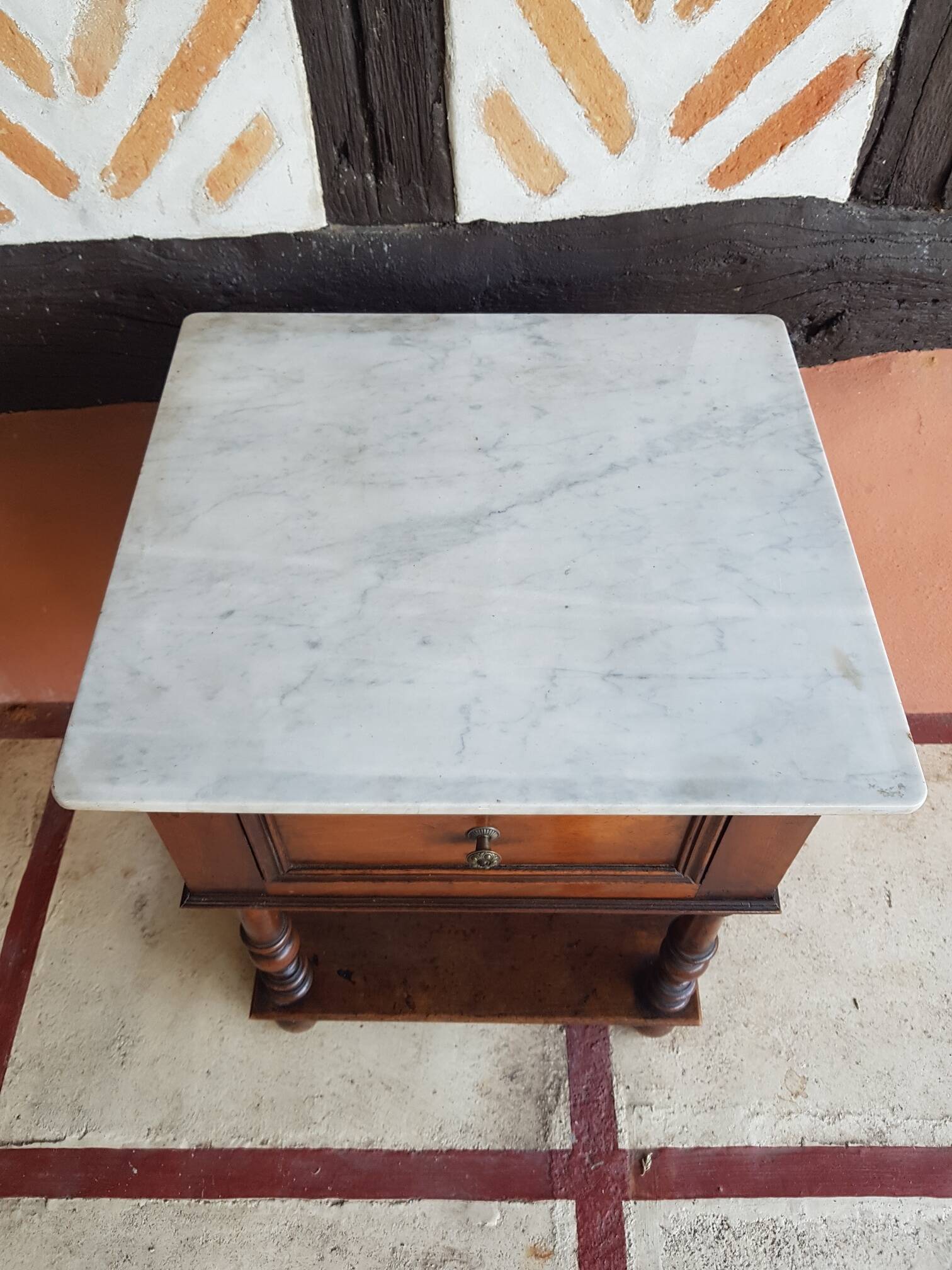 Old wooden marble bedside table