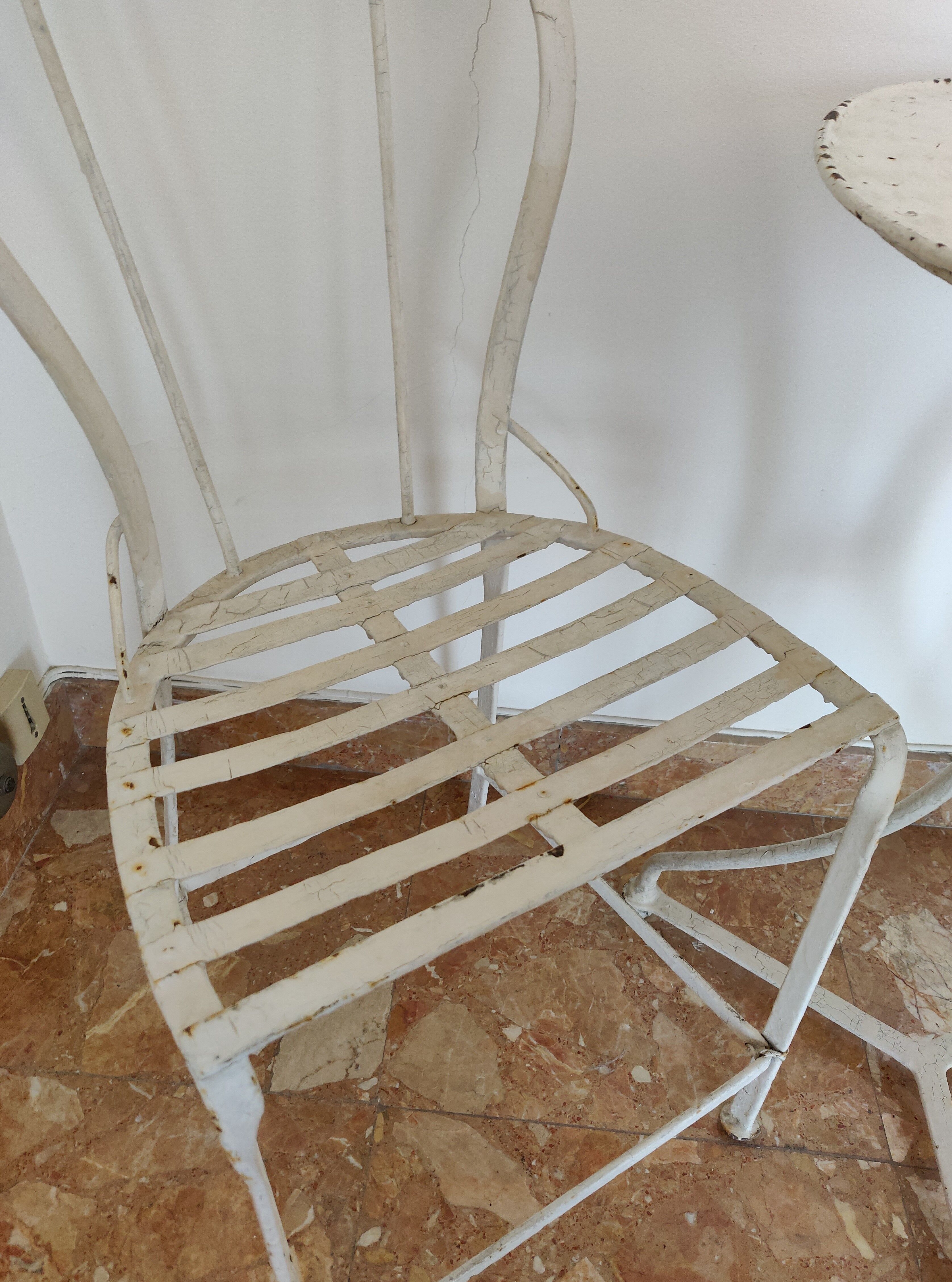 Table and bistro chairs wrought iron terrace