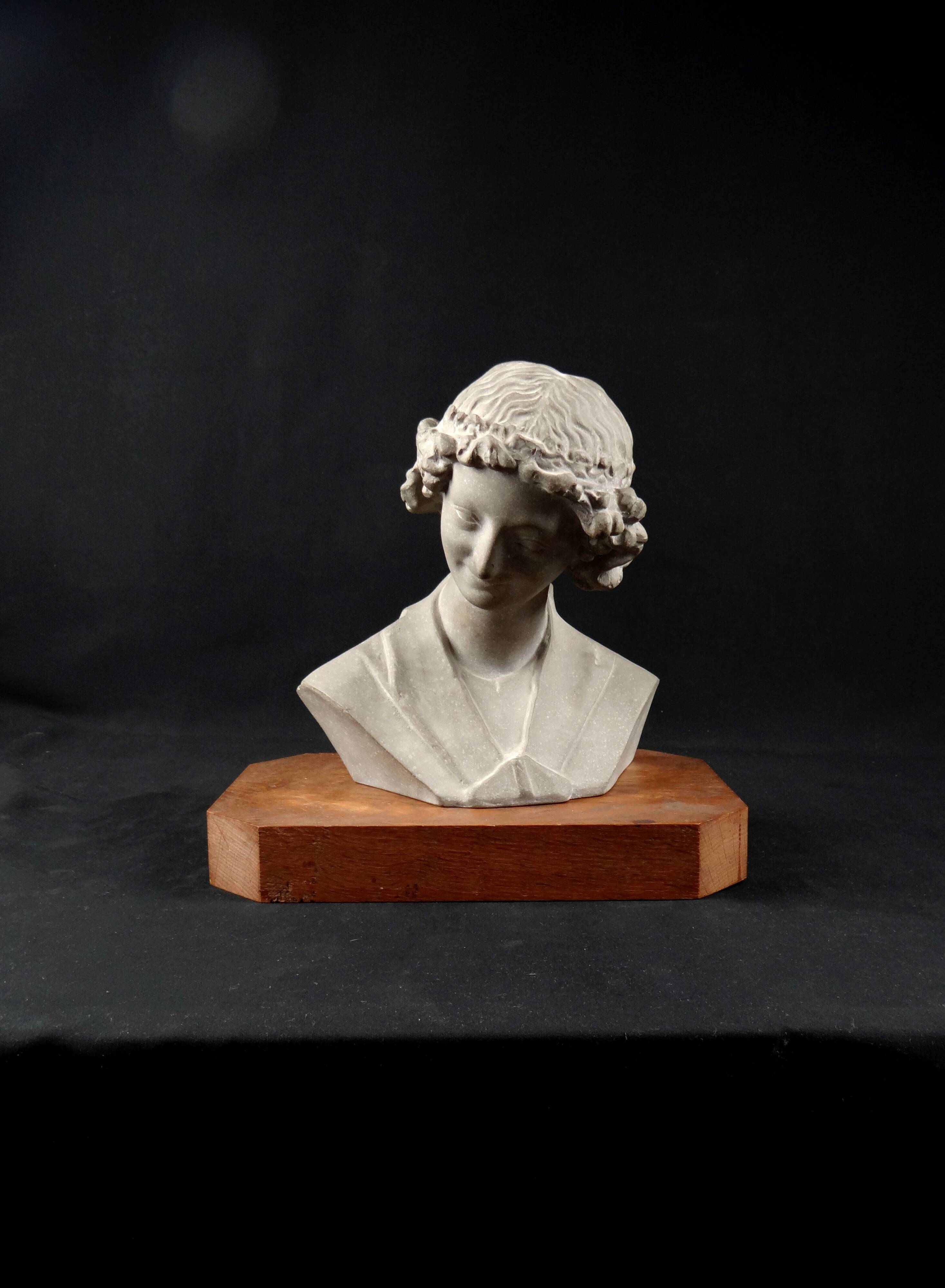 Terracotta bust of the smiling angel from Reims Cathedral with base