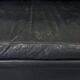 Canapé vintage Roche Bobois – modèle Soleil Noir – cuir noir patiné – 3 places