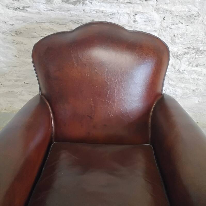 Club chair with floral backrest