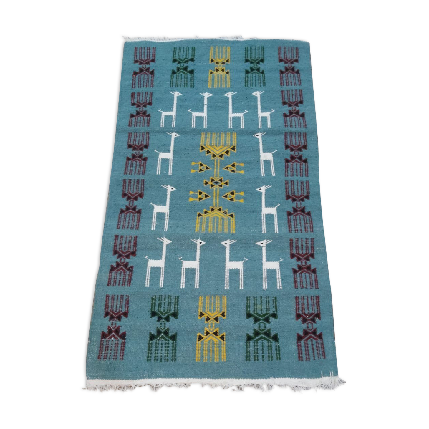 Blue carpet with gazelle patterns woven by hand