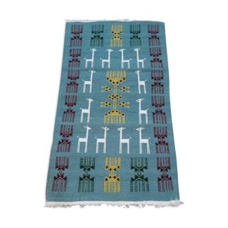 Tapis bleu à motifs gazelles tissé à la main
