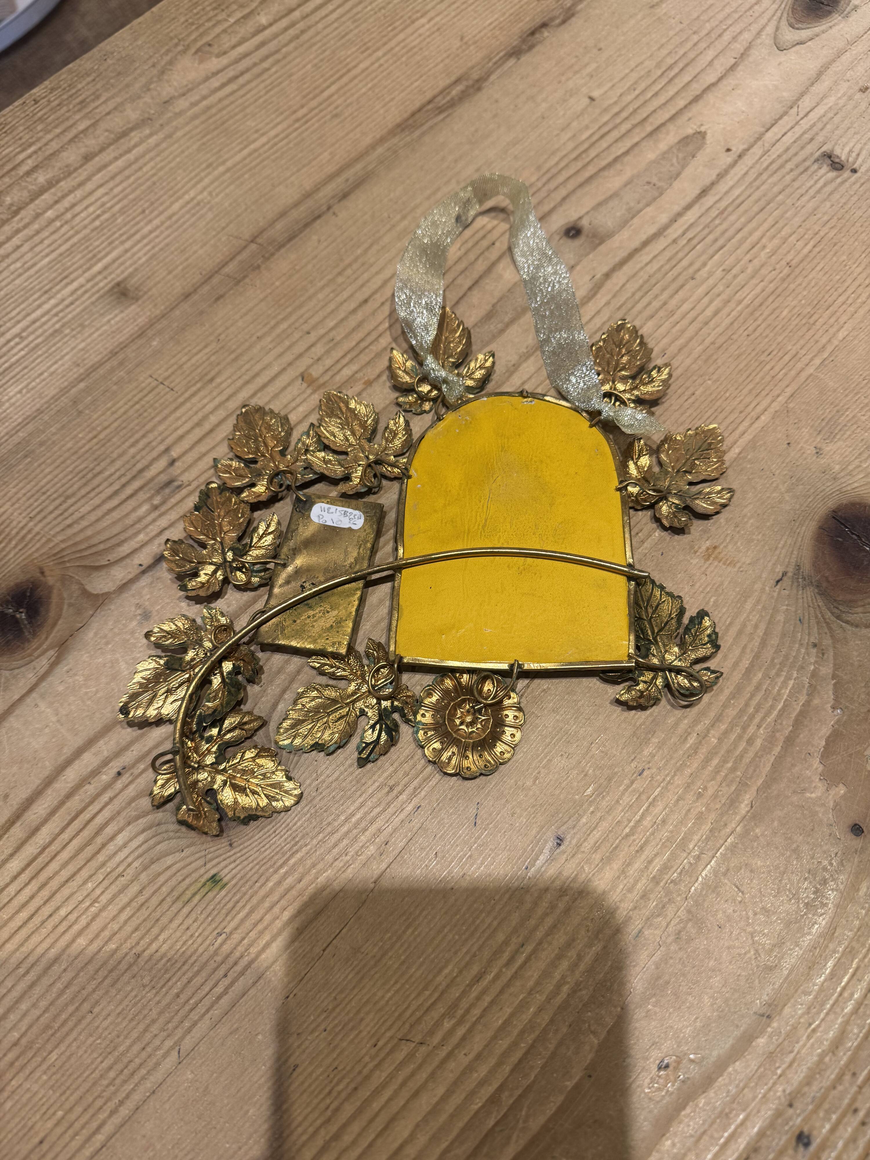 Ornamental brass mirror
